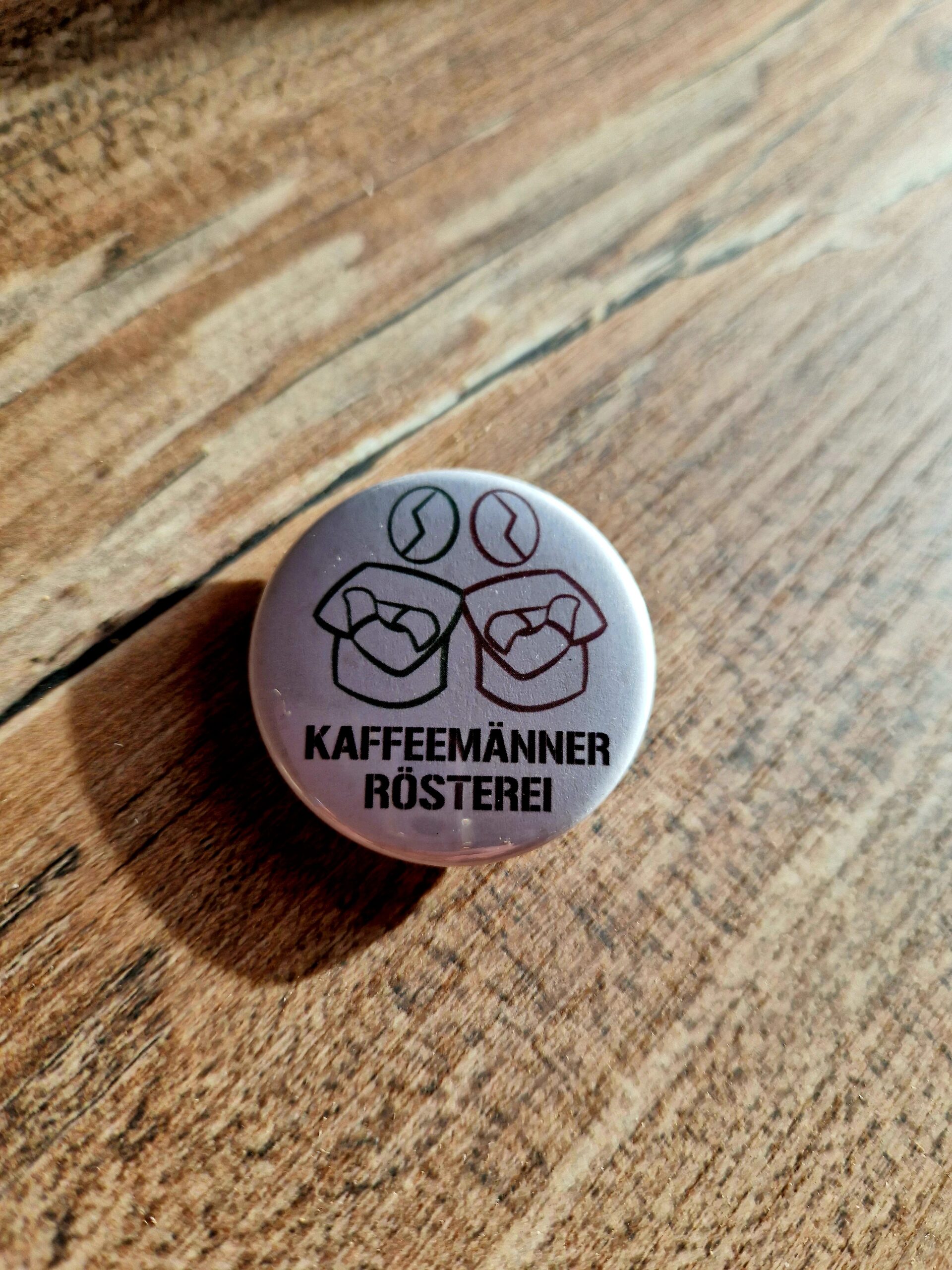 Kaffeemänner Button Kaffeemänner Button - Logo