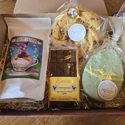 Osterbox mit Osterkaffee, Eierlikörschokolade, Osterkranz und Ostergebäck